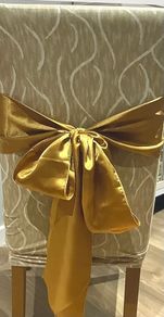 Gold satin chair sashes / bows