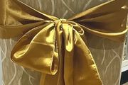 Gold satin chair sashes / bows