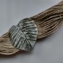 Handmade string bracelet in raw style. Leaf Image 2