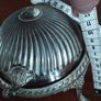 A vintage silver-plated butter dish or caviar bowl with a three-legged lid. Image 4