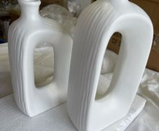 Brand new modern, hollow-center white ceramic/porcelain decorative donut-shaped vases.