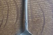 Vintage teaspoon with a saint on the handle