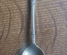 Vintage teaspoon with a saint on the handle
