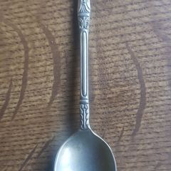 Vintage teaspoon with a saint on the handle