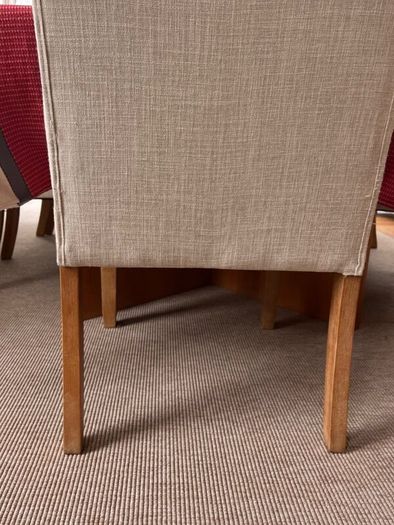 Cream button backed Kitchen chairs.