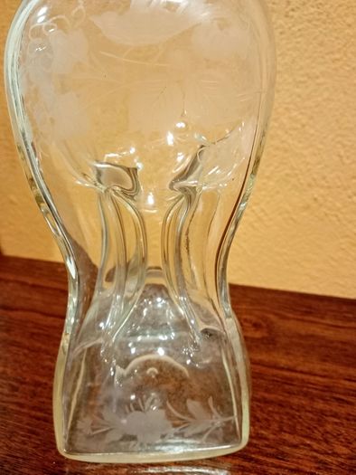 Antique hourglass shaped glass decanter