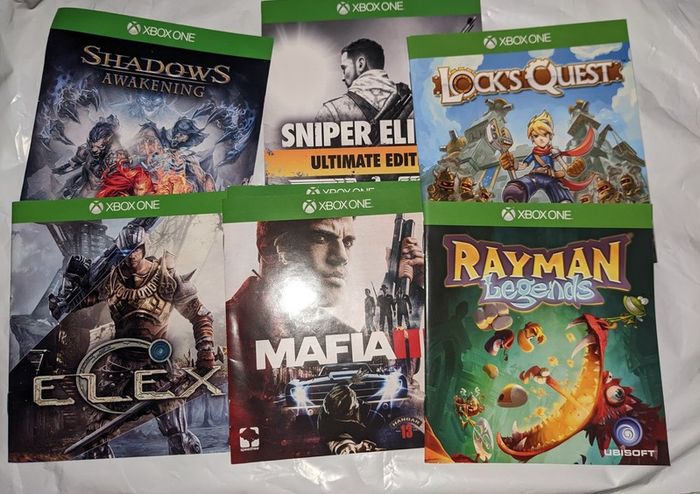 Gaming posters, manuals, DLC codes, art, post cards