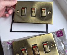 Antique brass electrical sockets and switches
