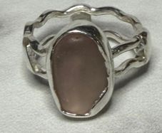 Handmade sterling silver wave ring with pink sea glass. Size L