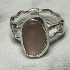 Handmade sterling silver wave ring with pink sea glass. Size L