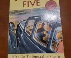 The Famous Five. five go to smuglers top