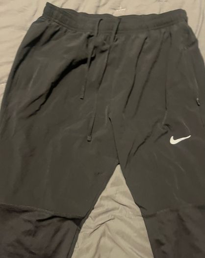 Nike Dri-FIT UV Challenger Men s Woven Hybrid Running Pants Nike Bottoms running pants size large