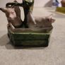 figurine of two pigs cooling down at bone china  water pump. Image 5