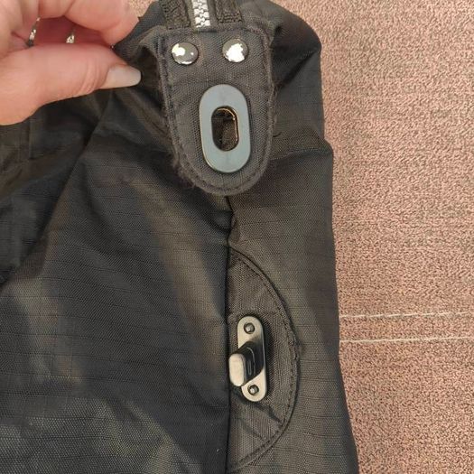 Large black expandable travel bag with shoulder strap
