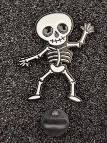 Dancing skeleton ,  pin back badge.