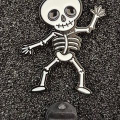 Dancing skeleton ,  pin back badge.