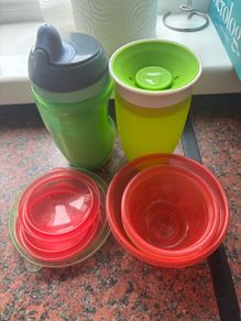 Selection of sippy cups and food containers