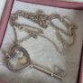 Pandora sterling silver key necklace with a heart,shaped floating locket and pink sparkling stones. Includes the two petite charms Image 3