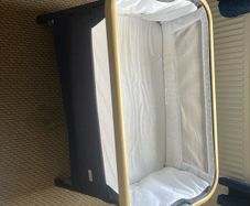 Tutti Bambini CoZee Lite Bedside Crib in Charcoal and Oak effect.
