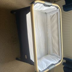 Tutti Bambini CoZee Lite Bedside Crib in Charcoal and Oak effect.