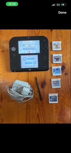 Nintendo 2DS with games and charger