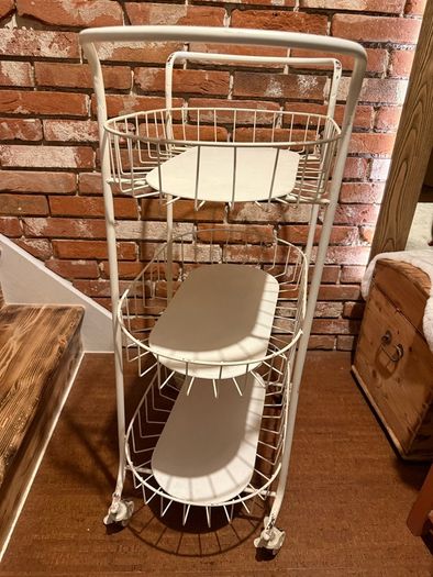 charming Iron shelf on wheels