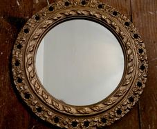 Vintage ornate gilt plaster circular mirror