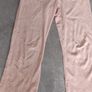 orange tracksuit bottom fits size sm worn Image 3