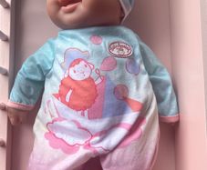 Baby doll with  baby Annabell onesie & accessories EUC