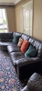 Brown leather couch and armchair