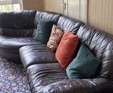 Brown leather couch and armchair