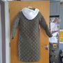 long green coat by bench Image 5