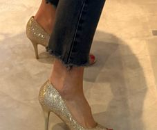 Gold glitter peep-toe heels.