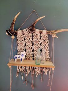 small shelf with deer antler