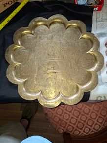 Antique Brass Charger Tray Hand-Engraved Mughal court figures. The Charger has a distinct Scalloped edge and is heavily decorated. Similar items often date from the late 19th century, specifically around the 1870s or 1880s