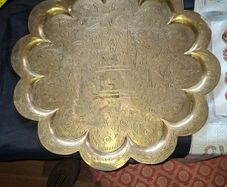 Antique Brass Charger Tray Hand-Engraved Mughal court figures. The Charger has a distinct Scalloped edge and is heavily decorated. Similar items often date from the late 19th century, specifically around the 1870s or 1880s