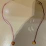 Rituals red/pink string bracelet with round Rituals engraved charm Image 5
