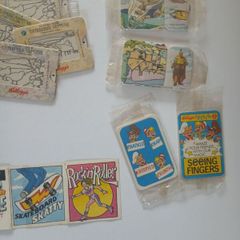 Scrace lot of 1980s retro cereal freebies . Kelloggs Rice crispies , sugar puffs stickers games and cards .