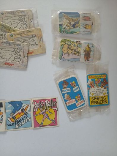 Scrace lot of 1980s retro cereal freebies . Kelloggs Rice crispies , sugar puffs stickers games and cards .