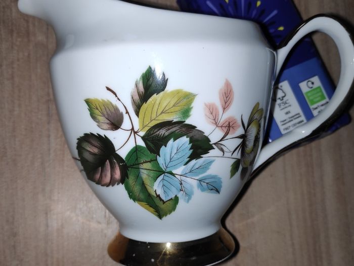 Vintage bone china Clare milk jug/creamer with blue & green leaves pattern & gilt bands & handle