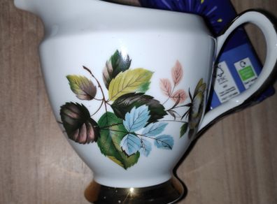 Vintage bone china Clare milk jug/creamer with blue & green leaves pattern & gilt bands & handle