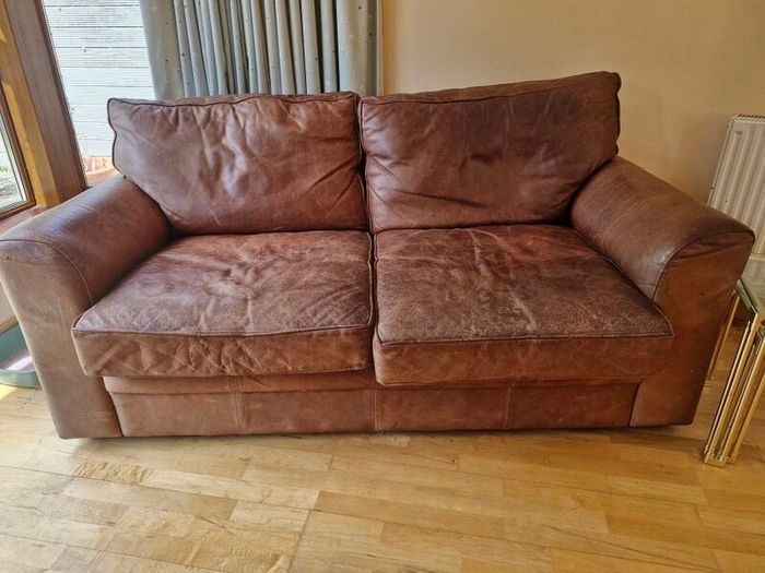 brown leather sofa and arm chair