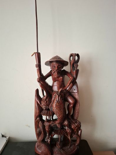 Hand carved wooden Balinese sculpture Fisherman