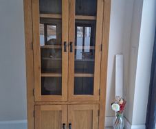 Solid oak display cabinet with glass doors