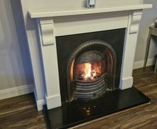 Beautiful fireplace with wood surround