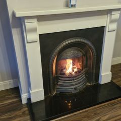 Beautiful fireplace with wood surround