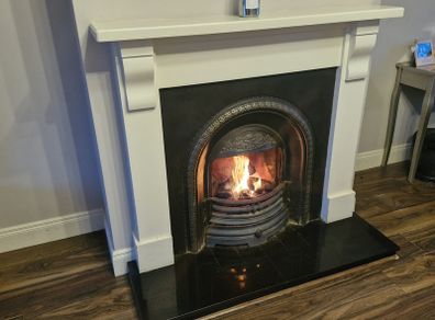 Beautiful fireplace with wood surround