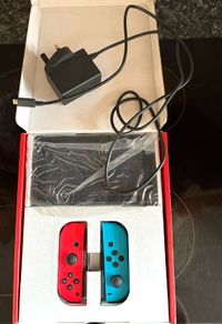 Nintendo Switch Neon Red/Blue with Improved Battery Life- Barely used