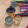 Large collection of  coloured candles and candle holders a few broken and few slightly used Image 2