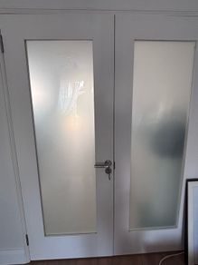 White wood and glass interior door